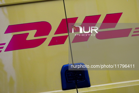 The DHL logo is on a delivery truck on the street in Krakow, Poland, on November 18, 2024. 