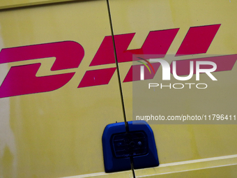 The DHL logo is on a delivery truck on the street in Krakow, Poland, on November 18, 2024. (