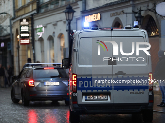 Police stop a car on the street in Krakow, Poland, on November 18, 2024. (