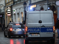 Police stop a car on the street in Krakow, Poland, on November 18, 2024. (