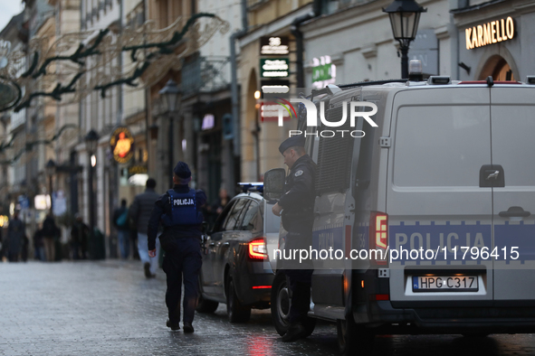 Police stop a car on the street in Krakow, Poland, on November 18, 2024. 