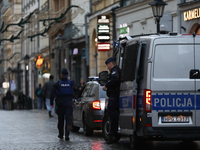 Police stop a car on the street in Krakow, Poland, on November 18, 2024. (