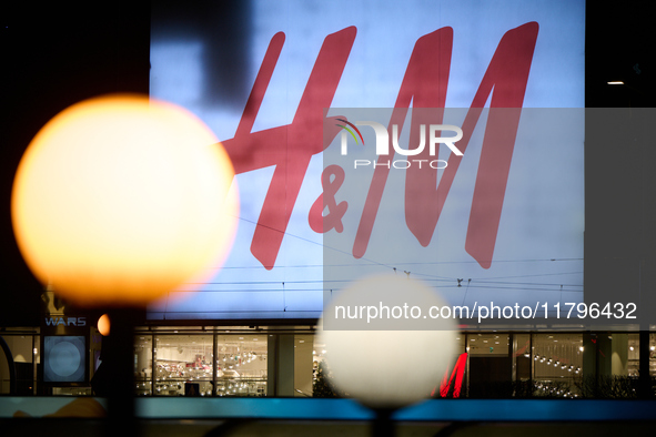 Advertisemetn for Hennis and Mauritz (H&M) shop is seen in Warsaw, Poland on 20 November, 2024. 