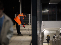 A worker is seen with a light meter on a train platform in Warsaw, Poland on 20 November, 2024. (