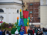 People walk past Christmas lights decoratoins prepared for the upcoming season in Warsaw, Poland on 18 November, 2024. Warsaw is an increasi...