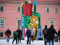 People walk past Christmas lights decoratoins prepared for the upcoming season in Warsaw, Poland on 18 November, 2024. Warsaw is an increasi...