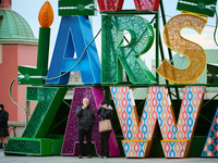 People walk past Christmas lights decoratoins prepared for the upcoming season in Warsaw, Poland on 18 November, 2024. Warsaw is an increasi...