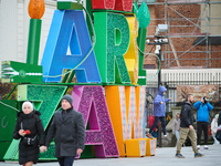 People walk past Christmas lights decoratoins prepared for the upcoming season in Warsaw, Poland on 18 November, 2024. Warsaw is an increasi...