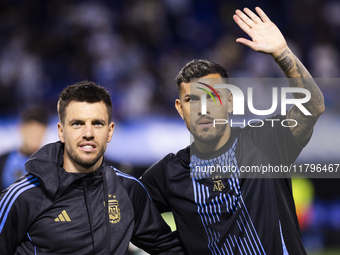 Argentina's Giovani Lo Celso and Leandro Paredes stand before the 2026 FIFA World Cup South American qualifiers football match between Argen...