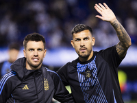 Argentina's Giovani Lo Celso and Leandro Paredes stand before the 2026 FIFA World Cup South American qualifiers football match between Argen...