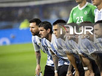 Argentina's Lionel Messi and teammates stand before the 2026 FIFA World Cup South American qualifiers football match between Argentina and P...