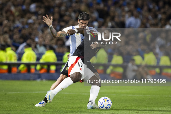 Peru's Luis Advincula competes with Argentina's Rodrigo De Paul during the 2026 FIFA World Cup South American qualifiers football match betw...