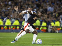 Peru's Luis Advincula competes with Argentina's Rodrigo De Paul during the 2026 FIFA World Cup South American qualifiers football match betw...