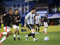 Argentina's Lionel Messi is in action during the 2026 FIFA World Cup South American qualifiers football match between Argentina and Peru at...