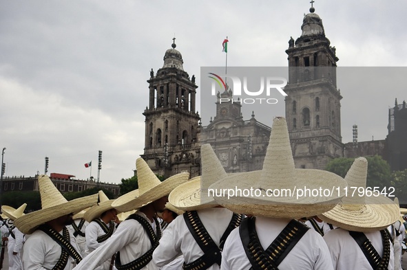 People participate in the military civic parade for the commemoration of the 114th anniversary of the Mexican Revolution at the main square...