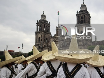 People participate in the military civic parade for the commemoration of the 114th anniversary of the Mexican Revolution at the main square...