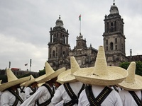 People participate in the military civic parade for the commemoration of the 114th anniversary of the Mexican Revolution at the main square...