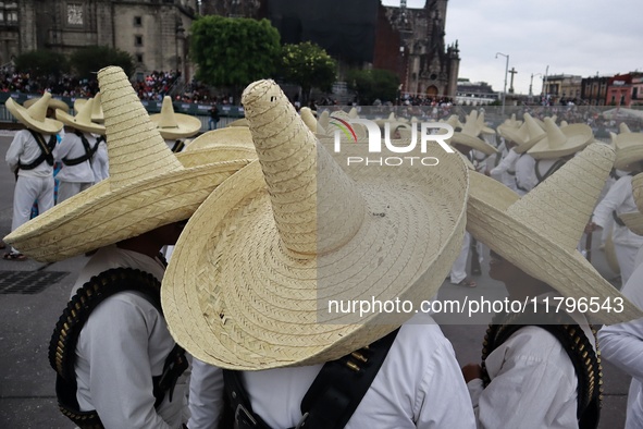 People participate in the military civic parade for the commemoration of the 114th anniversary of the Mexican Revolution at the main square...