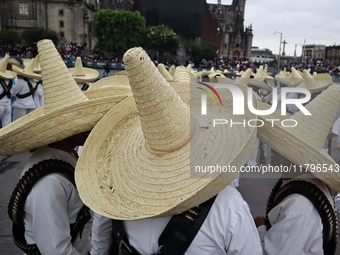 People participate in the military civic parade for the commemoration of the 114th anniversary of the Mexican Revolution at the main square...