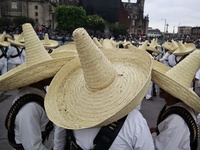 People participate in the military civic parade for the commemoration of the 114th anniversary of the Mexican Revolution at the main square...