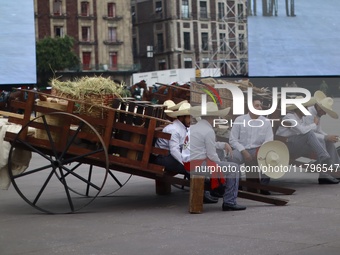 People participate in the military civic parade for the commemoration of the 114th anniversary of the Mexican Revolution at the main square...