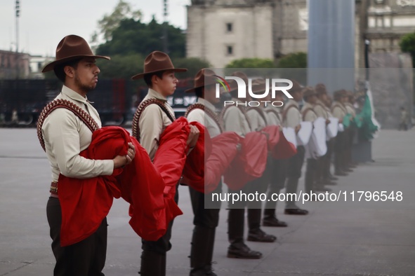 People participate in the military civic parade for the commemoration of the 114th anniversary of the Mexican Revolution at the main square...