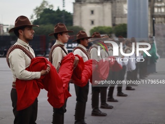 People participate in the military civic parade for the commemoration of the 114th anniversary of the Mexican Revolution at the main square...