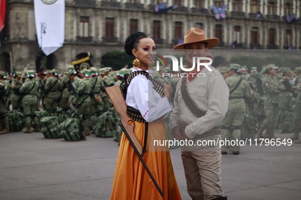 People participate in the military civic parade for the commemoration of the 114th anniversary of the Mexican Revolution at the main square...