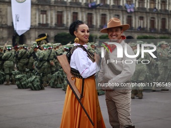 People participate in the military civic parade for the commemoration of the 114th anniversary of the Mexican Revolution at the main square...