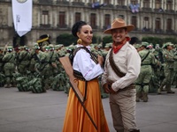 People participate in the military civic parade for the commemoration of the 114th anniversary of the Mexican Revolution at the main square...