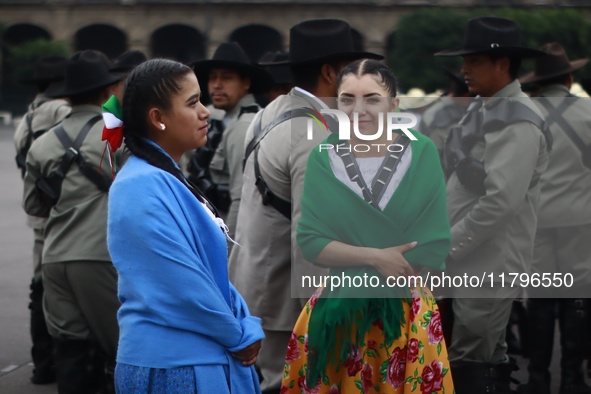 People participate in the military civic parade for the commemoration of the 114th anniversary of the Mexican Revolution at the main square...