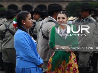 People participate in the military civic parade for the commemoration of the 114th anniversary of the Mexican Revolution at the main square...