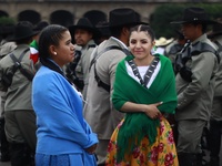 People participate in the military civic parade for the commemoration of the 114th anniversary of the Mexican Revolution at the main square...