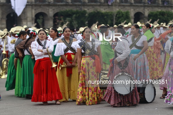 People participate in the military civic parade for the commemoration of the 114th anniversary of the Mexican Revolution at the main square...