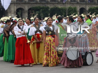 People participate in the military civic parade for the commemoration of the 114th anniversary of the Mexican Revolution at the main square...