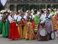 People participate in the military civic parade for the commemoration of the 114th anniversary of the Mexican Revolution at the main square...