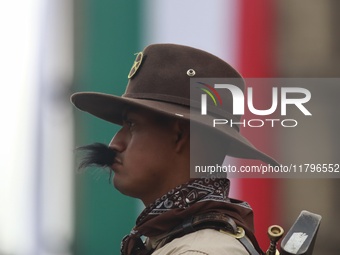 A person takes part in the military civic parade for the commemoration of the 114th anniversary of the Mexican Revolution at the main square...