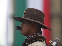 A person takes part in the military civic parade for the commemoration of the 114th anniversary of the Mexican Revolution at the main square...