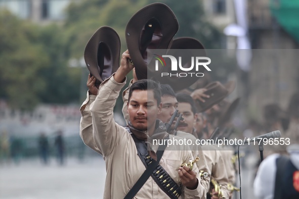 People participate in the military civic parade for the commemoration of the 114th anniversary of the Mexican Revolution at the main square...