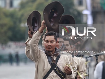 People participate in the military civic parade for the commemoration of the 114th anniversary of the Mexican Revolution at the main square...