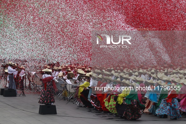 People participate in the military civic parade for the commemoration of the 114th anniversary of the Mexican Revolution at the main square...