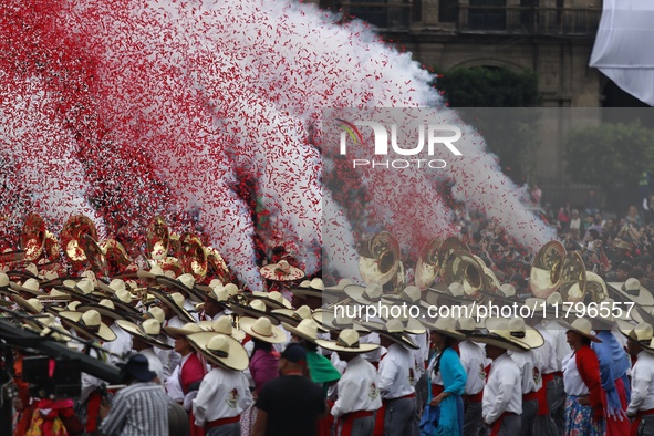 People participate in the military civic parade for the commemoration of the 114th anniversary of the Mexican Revolution at the main square...