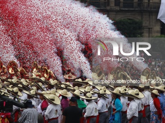 People participate in the military civic parade for the commemoration of the 114th anniversary of the Mexican Revolution at the main square...