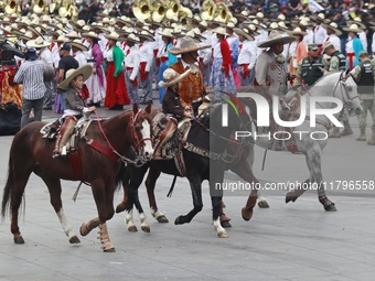 Charros take part in the military civic parade for the commemoration of the 114th anniversary of the Mexican Revolution at the main square Z...