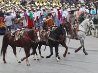 Charros take part in the military civic parade for the commemoration of the 114th anniversary of the Mexican Revolution at the main square Z...