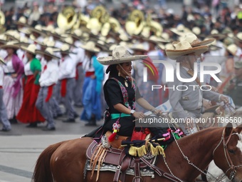 Charros take part in the military civic parade for the commemoration of the 114th anniversary of the Mexican Revolution at the main square Z...