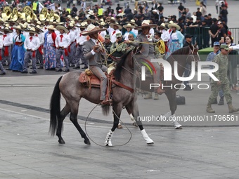 Charros take part in the military civic parade for the commemoration of the 114th anniversary of the Mexican Revolution at the main square Z...