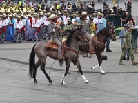 Charros take part in the military civic parade for the commemoration of the 114th anniversary of the Mexican Revolution at the main square Z...