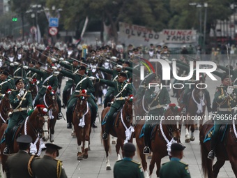 The military takes part in the military civic parade for the commemoration of the 114th anniversary of the Mexican Revolution at the main sq...