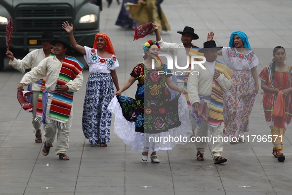 People participate in the military civic parade for the commemoration of the 114th anniversary of the Mexican Revolution at the main square...